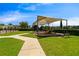 Shaded community playground area featuring slides and benches in a well-maintained grassy area at 9544 Mere Pkwy, Orlando, FL 32832