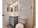 Cozy bathroom featuring a vanity with a single sink, toilet and a neutral color scheme at 9903 Turf Way # 4, Orlando, FL 32837