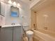 Bathroom with a tub and shower, a gray vanity, and tile flooring at 9903 Turf Way # 4, Orlando, FL 32837