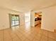 Comfortable living area with tile floors, leading to a balcony and open to the kitchen at 9903 Turf Way # 4, Orlando, FL 32837
