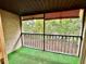 Outdoor screened patio with green turf and sun shades, offering a serene retreat at 9903 Turf Way # 4, Orlando, FL 32837