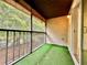 Cozy screened patio with green turf, providing outdoor relaxation space at 9903 Turf Way # 4, Orlando, FL 32837