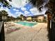 Community pool with poolside lounge chairs and lovely multi-Gathering buildings at 9903 Turf Way # 4, Orlando, FL 32837