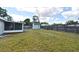 The large backyard has a screened-in patio, storage shed, and fenced perimeter for privacy and security at 994 Lormann Cir, Longwood, FL 32750