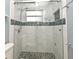 Contemporary bathroom showcases tiled shower with glass doors and built-in niche at 994 Lormann Cir, Longwood, FL 32750