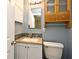 Bathroom featuring modern vanity, mirror, lighting, and mosaic tile backsplash at 994 Lormann Cir, Longwood, FL 32750