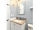 Cozy bathroom vanity with granite countertop, mosaic backsplash, and modern fixtures at 994 Lormann Cir, Longwood, FL 32750