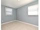 Inviting bedroom with neutral walls, tiled floor, and bright windows with blinds at 994 Lormann Cir, Longwood, FL 32750
