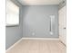 Airy bedroom featuring a window with blinds, tiled flooring, and full-length mirror at 994 Lormann Cir, Longwood, FL 32750