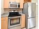 Stainless steel appliances, including an oven and refrigerator, are featured in the kitchen at 994 Lormann Cir, Longwood, FL 32750