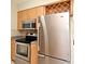 Kitchen with stainless steel appliances, including oven, microwave, and refrigerator at 994 Lormann Cir, Longwood, FL 32750