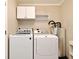 Bright laundry room featuring white washer and dryer units at 994 Lormann Cir, Longwood, FL 32750