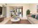 Inviting living room with stylish furniture, a rug, and an open view to the dining area at 994 Lormann Cir, Longwood, FL 32750