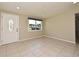The living room features tile floors, a front door, and a window for natural light at 994 Lormann Cir, Longwood, FL 32750