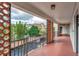 Charming balcony view showcasing lush greenery and the building, perfect for relaxing outdoors at 100 S Interlachen Ave # 410F, Winter Park, FL 32789