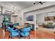 View of the clubhouse boasting multiple table and chair sets, neutral paint, and mounted TV at 100 S Interlachen Ave # 410F, Winter Park, FL 32789