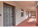 Apartment exterior hallway featuring unit number 410, leading to stylish living spaces at 100 S Interlachen Ave # 410F, Winter Park, FL 32789
