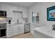 Modern kitchen featuring stainless steel appliances and bright, white cabinetry at 100 S Interlachen Ave # 410F, Winter Park, FL 32789