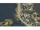 Aerial view of home showcasing location along lake at 1002 Lake Elbert Se Dr, Winter Haven, FL 33880