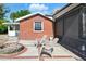 Private patio with a fire pit and chairs, perfect for outdoor enjoyment at 1002 Lake Elbert Se Dr, Winter Haven, FL 33880