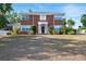 Beautiful two-story home with classic brick facade, manicured landscaping, and a welcoming front entrance at 1002 Lake Elbert Se Dr, Winter Haven, FL 33880