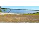 Expansive lake view near a sandy shore, providing a serene and natural setting for relaxation and recreation at 1002 Lake Elbert Se Dr, Winter Haven, FL 33880