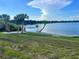 Scenic lake view with lush trees, clear skies, and serene waters at 1002 Lake Elbert Se Dr, Winter Haven, FL 33880