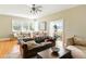 Bright living room with stylish furnishings, hardwood floors, and an exercise area, perfect for relaxation and fitness at 1002 Lake Elbert Se Dr, Winter Haven, FL 33880