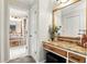 Bathroom vanity with wood cabinets, granite counters and a walk-in closet, perfect for getting ready at 10049 Custer Cir, Orlando, FL 32817