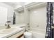 Bright bathroom with a tiled shower-tub combination and a white sink vanity at 10049 Custer Cir, Orlando, FL 32817