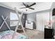 bedroom with a large ceiling fan, neutral walls, and carpeted floors at 10049 Custer Cir, Orlando, FL 32817