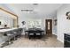 Dining room with wood-look flooring, elegant table set, and abundant natural light at 10049 Custer Cir, Orlando, FL 32817