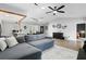 Open-concept living space with modern furniture, wood flooring, and stylish decor elements at 10049 Custer Cir, Orlando, FL 32817