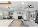 Open floor plan showcasing the living area's wood floors and smooth transition to screened patio at 10049 Custer Cir, Orlando, FL 32817