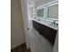 Bright bathroom with dual vanities, modern fixtures, marble floors, and a soaking tub at 1005 Randall St, Orlando, FL 32805