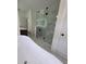 Modern bathroom boasts a freestanding tub and glass enclosed shower with tiled surround at 1005 Randall St, Orlando, FL 32805