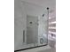 Modern bathroom boasts a soaking tub and glass enclosed shower with tiled surround at 1005 Randall St, Orlando, FL 32805