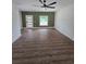 Bright living room featuring hardwood floors and a modern accent wall at 1005 Randall St, Orlando, FL 32805