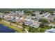 Beautiful aerial view of the neighborhood with lake access and lush landscaping at 1021 Whalebone Bay Dr, Kissimmee, FL 34741