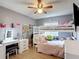 Bedroom featuring a bunk bed, ceiling fan, vanity, and window at 1021 Whalebone Bay Dr, Kissimmee, FL 34741