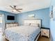 Cozy bedroom with a comfortable bed, dresser, and a ceiling fan at 1021 Whalebone Bay Dr, Kissimmee, FL 34741