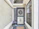 Inviting entryway with decorative door and a 'Welcome' mat, alongside potted plants creating a warm ambiance at 1021 Whalebone Bay Dr, Kissimmee, FL 34741