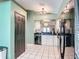 Well-maintained kitchen featuring a black refrigerator and stainless steel appliances at 1021 Whalebone Bay Dr, Kissimmee, FL 34741