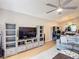 Bright living room featuring a large TV, modern furniture, and open layout at 1021 Whalebone Bay Dr, Kissimmee, FL 34741