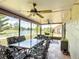 Relaxing screened-in patio with ceiling fans overlooking a picturesque water view at 1021 Whalebone Bay Dr, Kissimmee, FL 34741