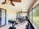 Inviting screened patio features tile flooring, ceiling fans, and an outdoor dining area at 1021 Whalebone Bay Dr, Kissimmee, FL 34741