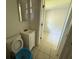 Compact bathroom featuring tile flooring, toilet, and a vanity with sink at 1108 Bear Lake Rd, Apopka, FL 32703