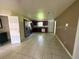 Spacious kitchen with tile flooring, stainless steel appliances, and dark wood cabinets at 1108 Bear Lake Rd, Apopka, FL 32703
