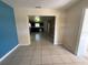 Spacious living room with tile flooring leading into the kitchen area at 1108 Bear Lake Rd, Apopka, FL 32703