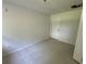 Neutral colored room featuring tile flooring and a door leading to the outside at 1108 Bear Lake Rd, Apopka, FL 32703